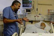 Rashad Rizeq talks to one of his patients